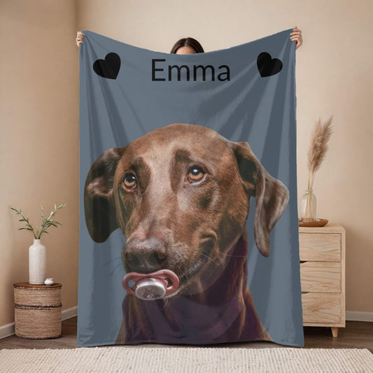 Person holding a blanket with a dog's face and name 'Emma' on it.