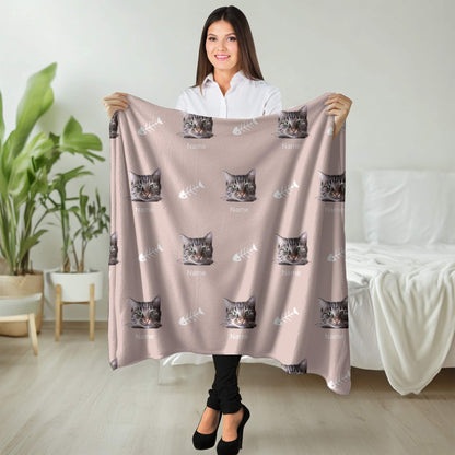 Woman holding a blanket with cat patterns in a room with plants and furniture.