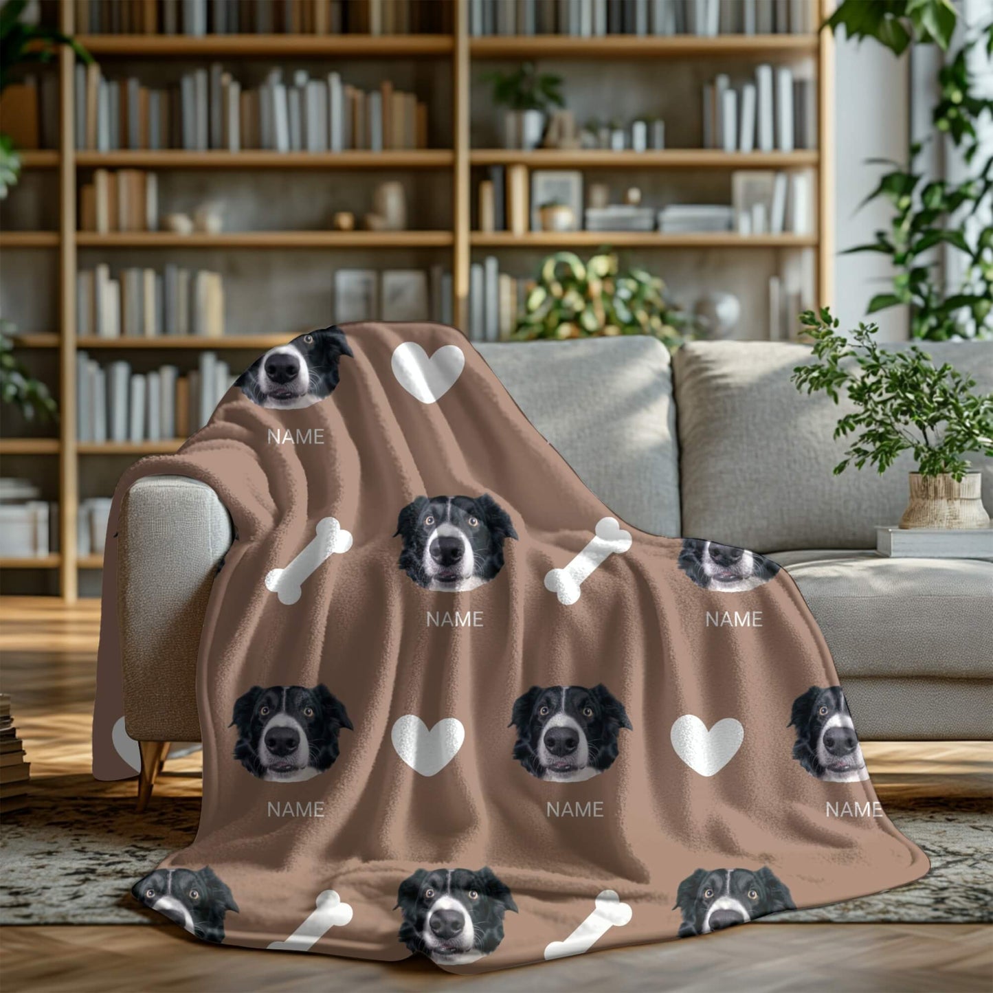 Brown blanket with dog faces and bones on a couch in a living room setting
